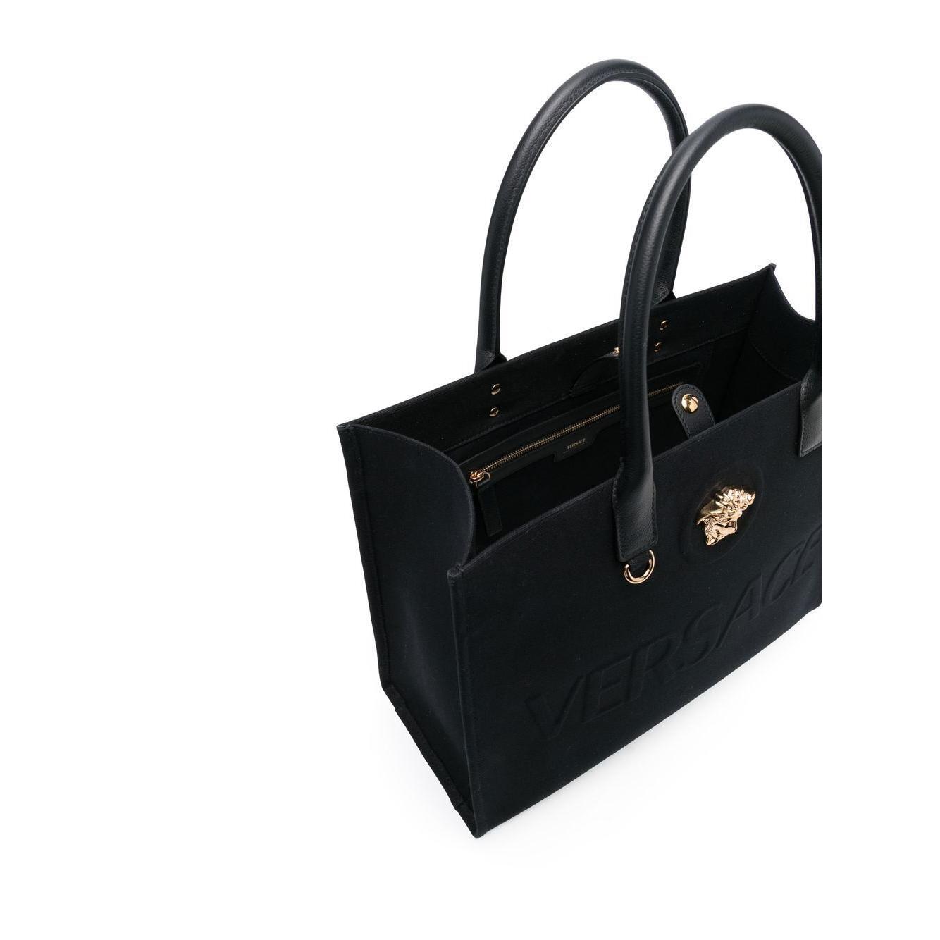 Front view with bag zipped and handles upright.