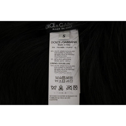 Dolce & Gabbana black silver fox fur scarf care label showing composition and cleaning instructions.