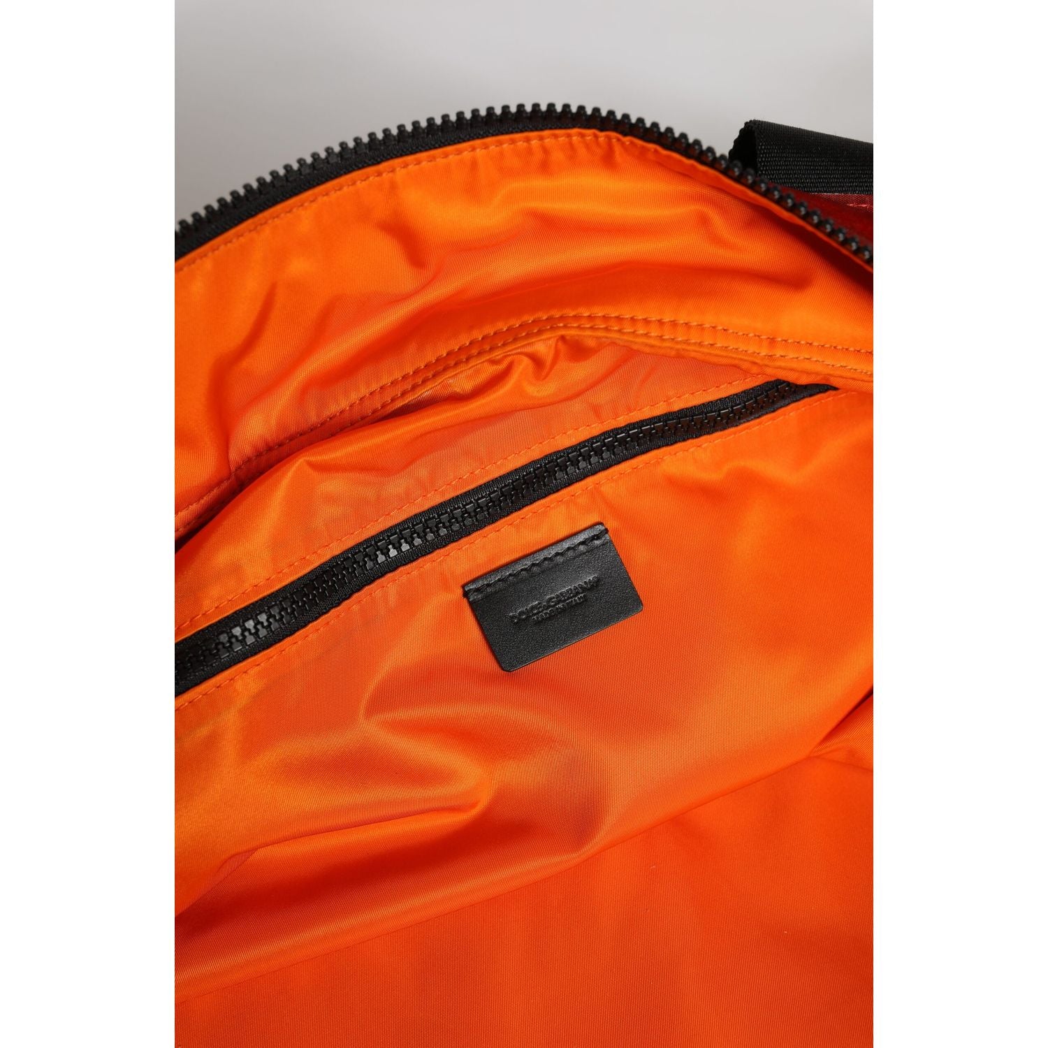 Front view with bag zipped and handles upright.